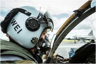 SwAFHF pilot Per Weilander prepares for an air-to-air photoshoot with the Viggen visible in the background