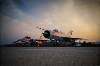 KPAAF static display at sunset,  Mig-21,  Su-25,  Mig-29,  and MD-500