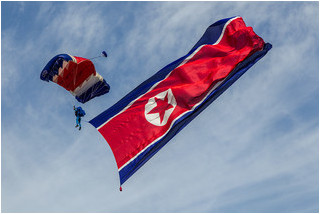 Pyongyang Air Club parachutist with the DPRK flag