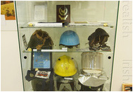 Display case with various artefacts and helmets